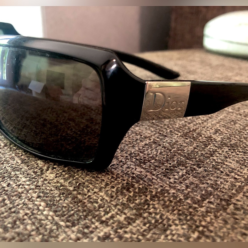 Christian Dior black wrap sunglasses with silver hardware and with case.